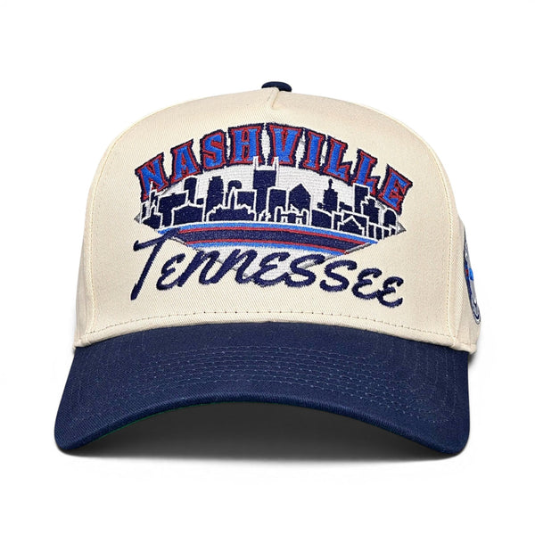 Nashville Snapback - The McNair: Retro two-tone cap with NASHVILLE and city skyline, celebrating the Tennessee Titans and 1999's vintage charm.