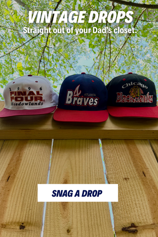 3 vintage hats hanging on wooden fence with overlay text "Vintage Drops" promoting the collection.