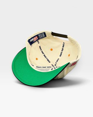 Inside view of the Tennessee Snapback - The Neyland, featuring a vintage cream design with a green under-bill and SHELLS Vintage label. Perfect throwback for football fans.