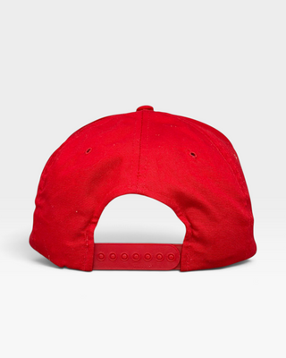 Shells Vintage Hat Co. red Yupoong snapback cap showing the adjustable plastic strap closure from the back