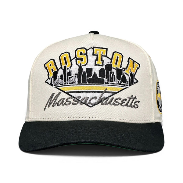 Boston Snapback - The Bergeron: Retro baseball cap featuring “BOSTON” embroidery and skyline silhouette, inspired by vintage Bruins styles, perfect for sports enthusiasts and nostalgic fans.