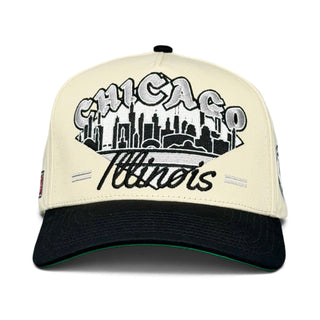 Two-tone baseball cap featuring a retro Chicago skyline and Chicanos embroidery, inspired by White Sox tradition, embodying Shells Vintage Hat Co.'s throwback style.