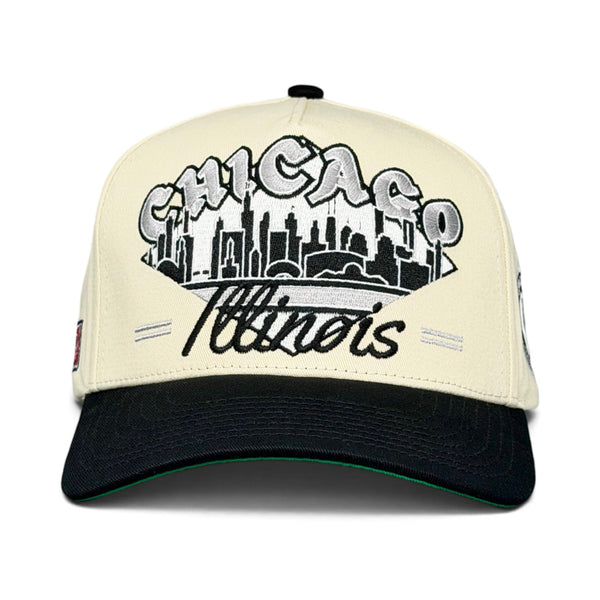Two-tone baseball cap featuring a retro Chicago skyline and Chicanos embroidery, inspired by White Sox tradition, embodying Shells Vintage Hat Co.'s throwback style.