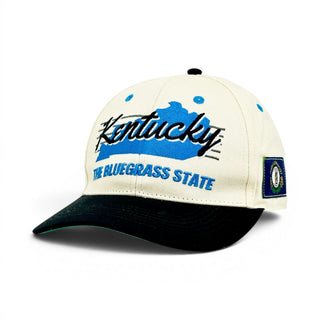 Kentucky Snapback - The Rupp (Cream/Black) featuring Kentucky embroidery, script text, and state seal patch, celebrating the state's rich basketball tradition.