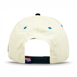 Kentucky Snapback - The Rupp features a beige design with a black snap-back, blue eyelets, and a label from Shells Vintage Hat Co.