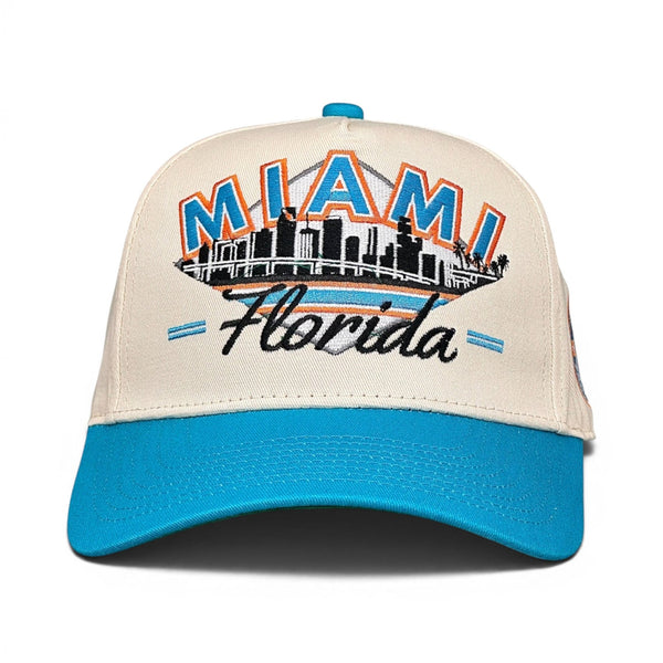 Retro Miami Snapback - The Marino hat, featuring an embroidered Miami skyline, block MIAMI text, and Florida script, pays tribute to Dolphins' legend, Dan Marino.