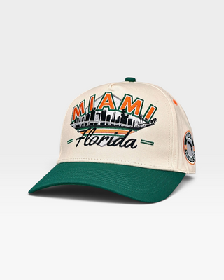 Miami Snapback - The U: A retro baseball cap featuring Miami skyline embroidery and MIAMI text, evoking 2001's legendary Hurricanes football era.